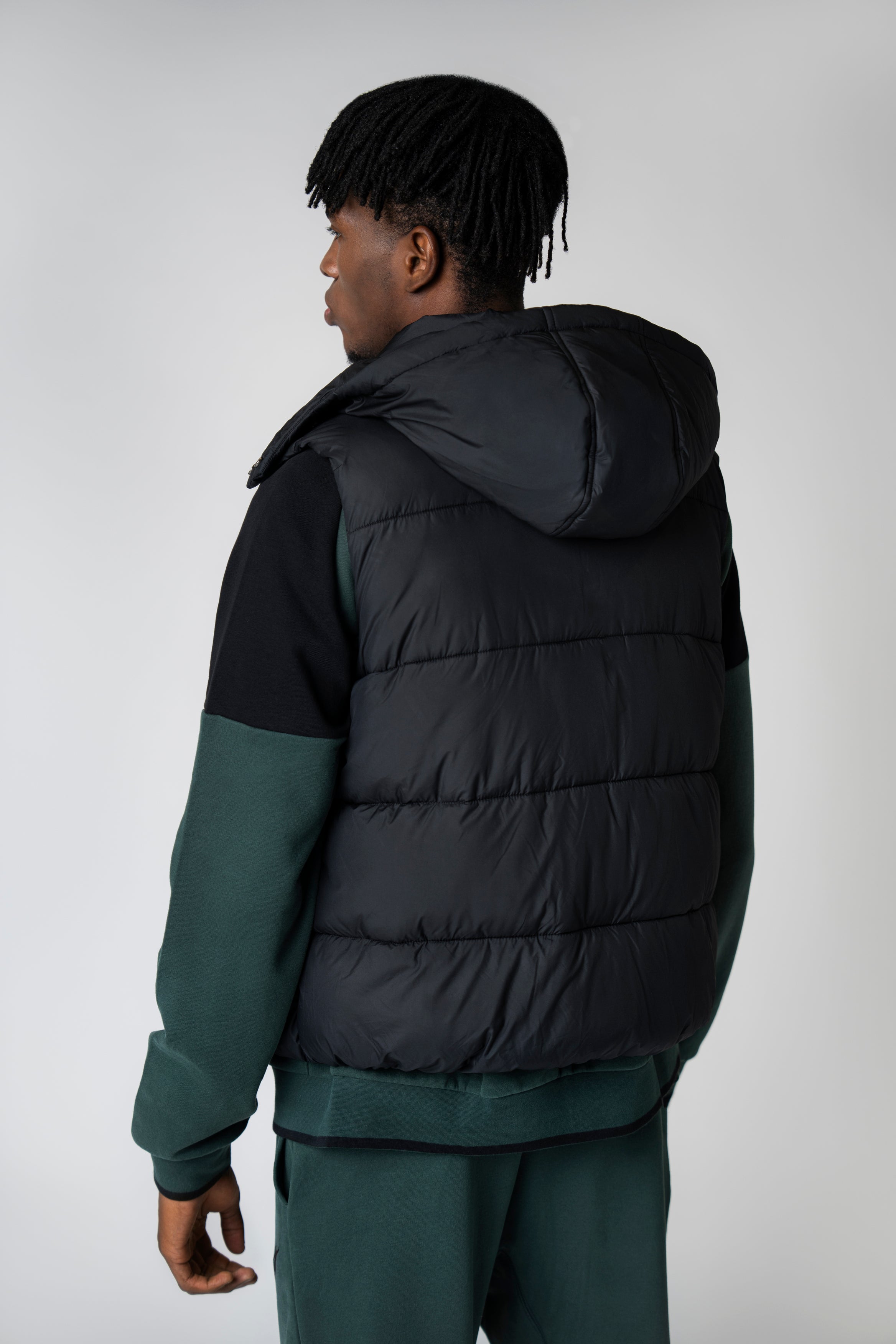 Collection of UACO black padded vest in a gallery layout