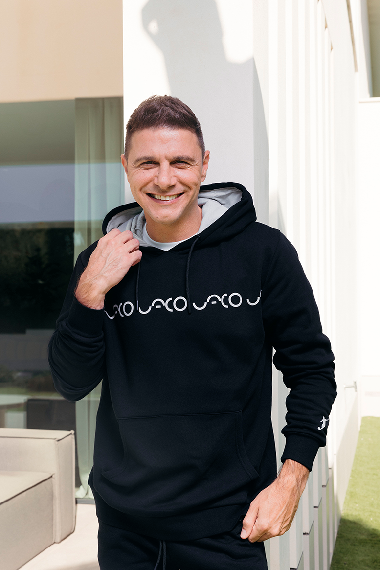 Collection of Sudadera UACO con capucha negra in a gallery layout